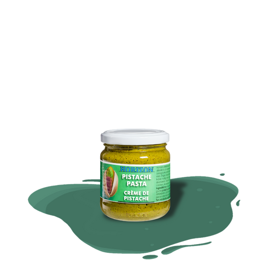 Smooth organic pistachio butter made from 100% ground pistachios, rich in fiber, protein, unsaturated fats, and essential minerals like iron, potassium, and magnesium.